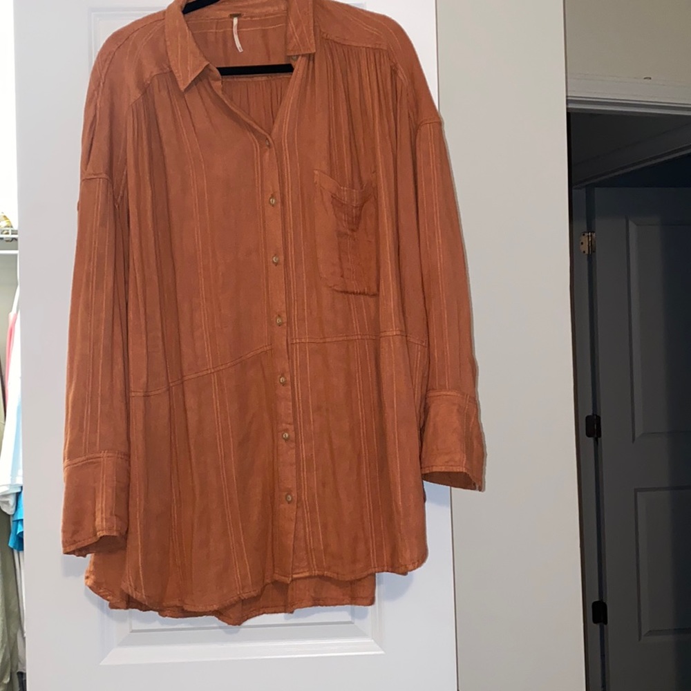 Free People button down top. Burgundy-rust color. Fits loose.